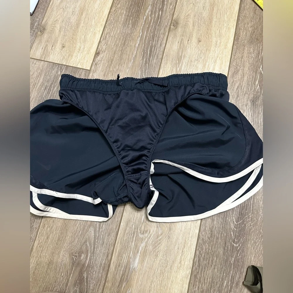 🛍️ Nike dri-fit black with white trimmed shorts great condition.